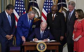 ENVIRONMENT, TAX AND HEAKTH BILLS ARE SIGNED INTO LAW BY BIDEN